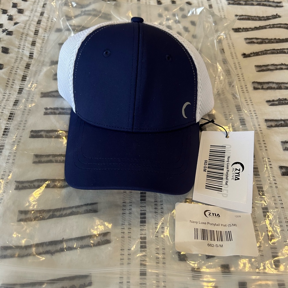 BNWT and bag Zyia Navy Luxe Ponytail Hat size S/M